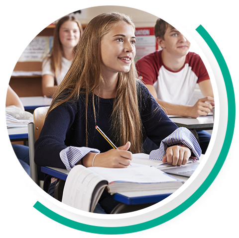 Group of students in a classroom listening attentively